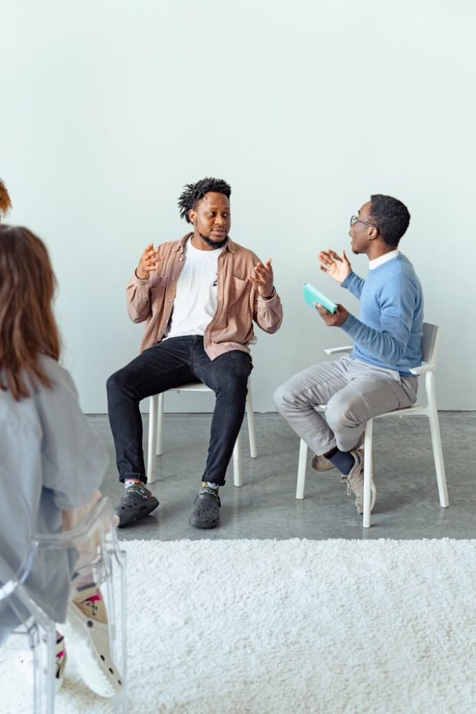 Therapist and client in a dynamic discussion during a therapy session with a focus on mental health.